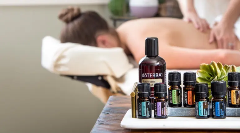 a group of bottles of essential oils on a table