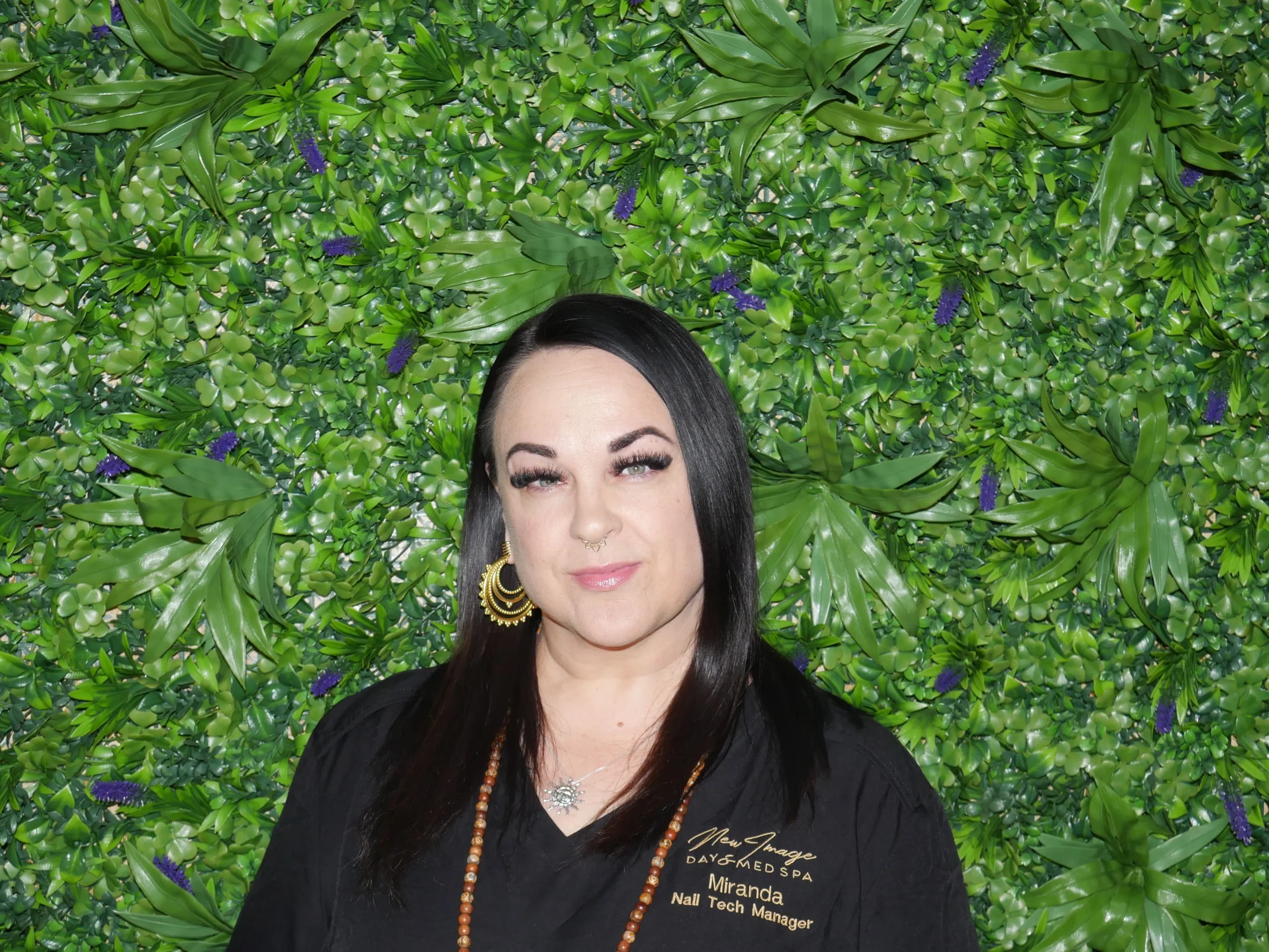 a woman with long hair and a necklace
