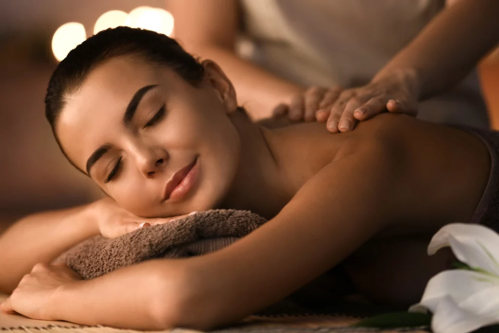 a woman lying down with her eyes closed