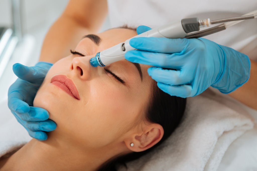 a woman receiving a face massage