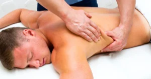 Man receiving a relaxing Sports Massage in OGDEN, UTAH, focusing on muscle recovery and tension relief.