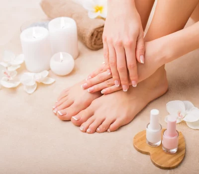 a close-up of a woman's feet and hands