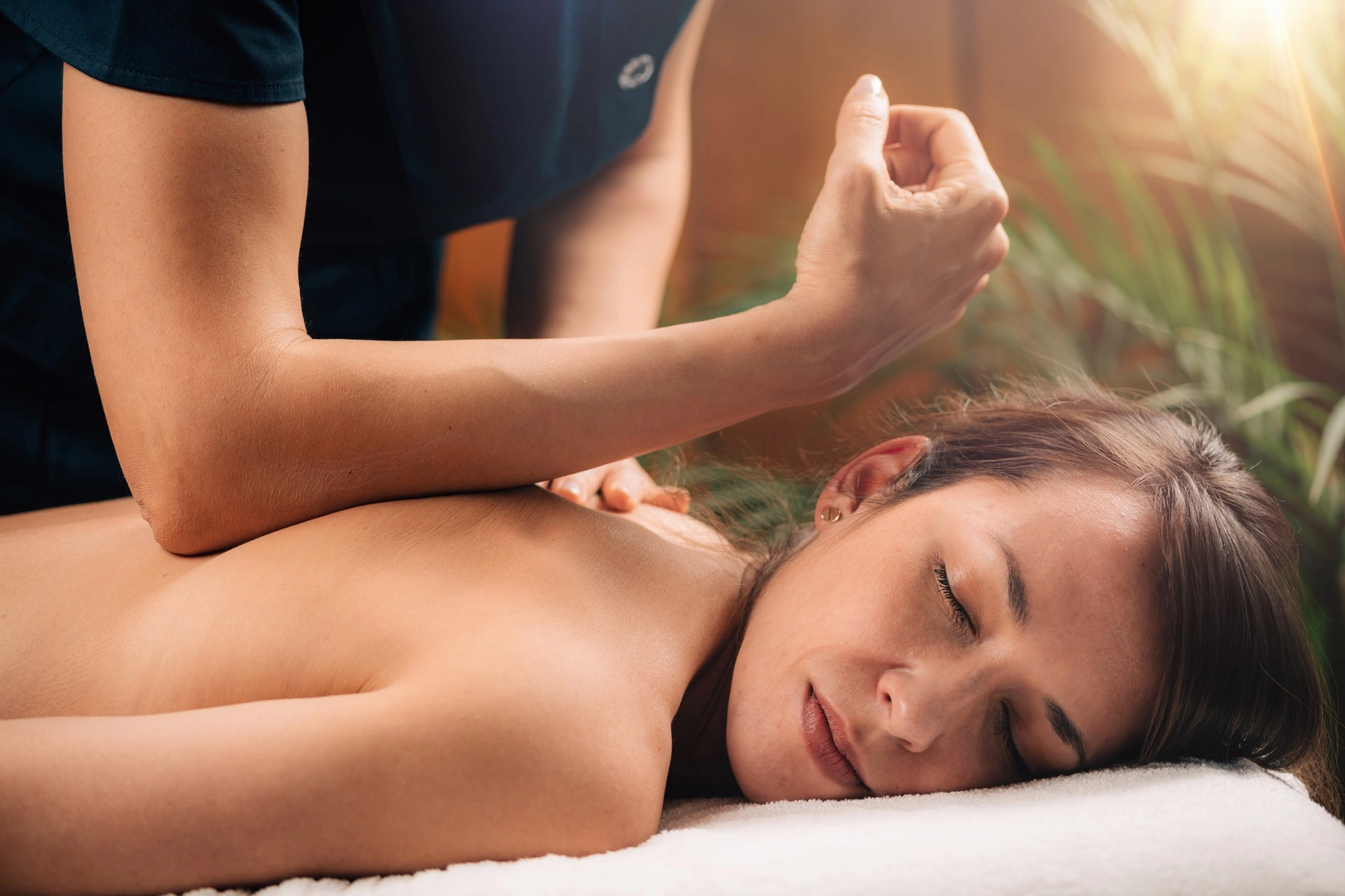 a woman lying down on a massage table