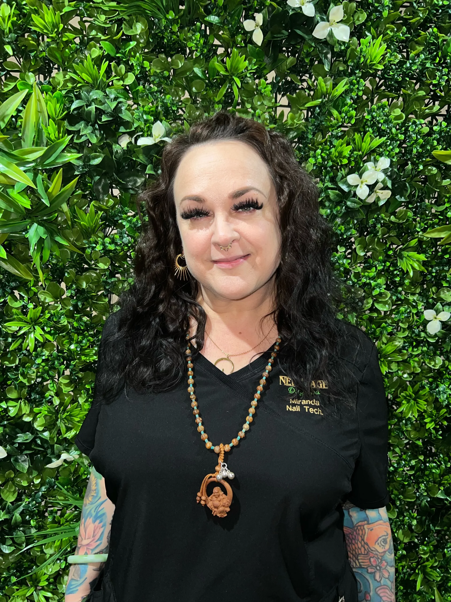 a woman with long hair and a necklace